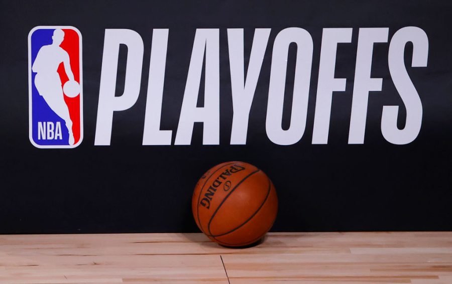LAKE BUENA VISTA, FLORIDA - AUGUST 26: A basketball sits next to an NBA Playoffs logo in Game Five of the Eastern Conference First Round scheduled between the Milwaukee Bucks and the Orlando Magic during the 2020 NBA Playoffs at AdventHealth Arena at ESPN Wide World Of Sports Complex on August 26, 2020 in Lake Buena Vista, Florida. NOTE TO USER: User expressly acknowledges and agrees that, by downloading and or using this photograph, User is consenting to the terms and conditions of the Getty Images License Agreement. (Photo by Kevin C. Cox/Getty Images)